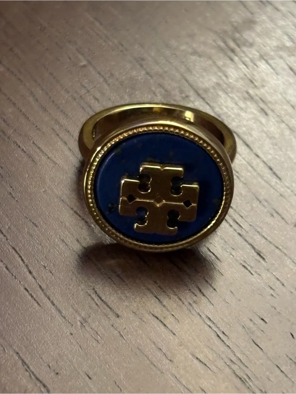 Tory Burch Gold-plated Ring with Deep Blue cover Logo.